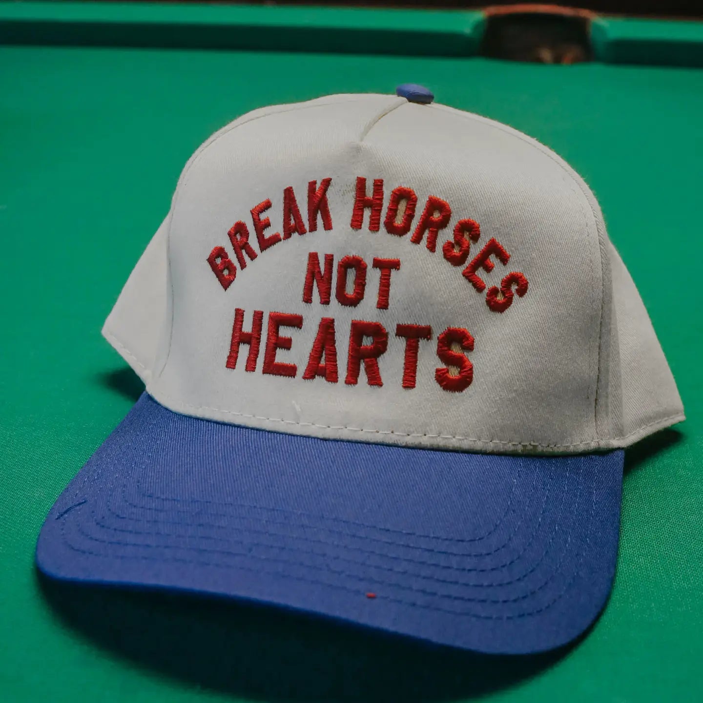 Break horses not hearts trucker hat